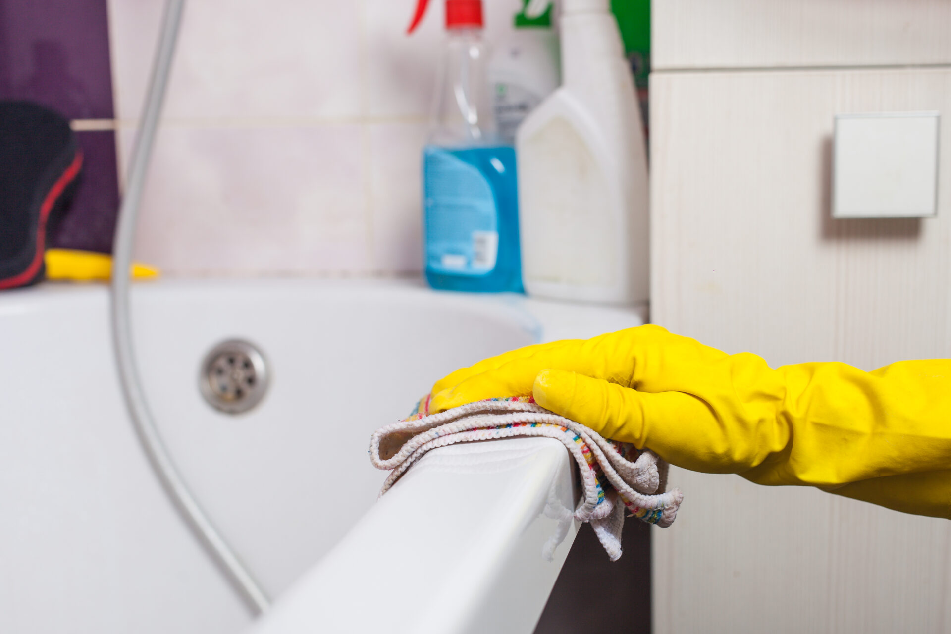 Maid with rubber glove cleaning