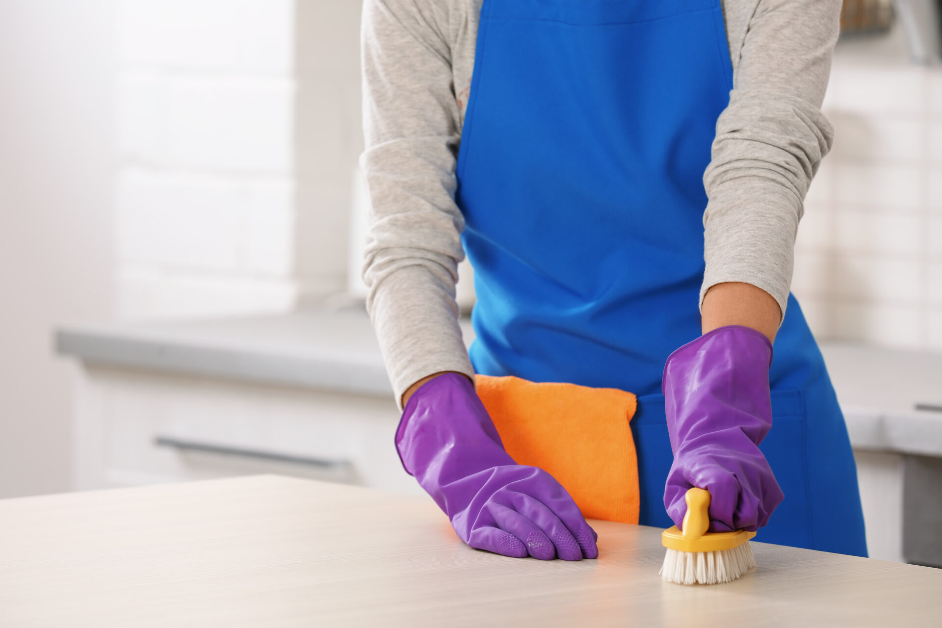 Woman cleaning table