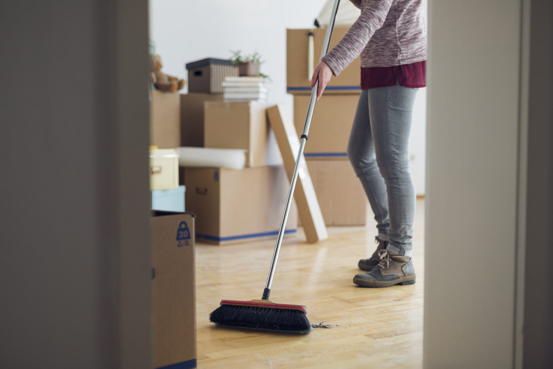 Woman sweeping the floor